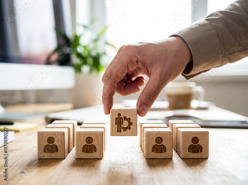 Hand placing a family icon into a box on a table with other icons, modern visual style, creative visual concept