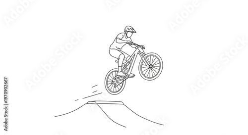 Man riding mountain bike airborne.