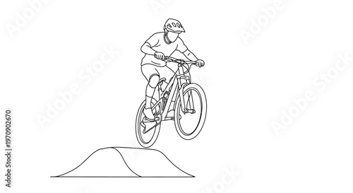 Man riding bicycle on a jump.