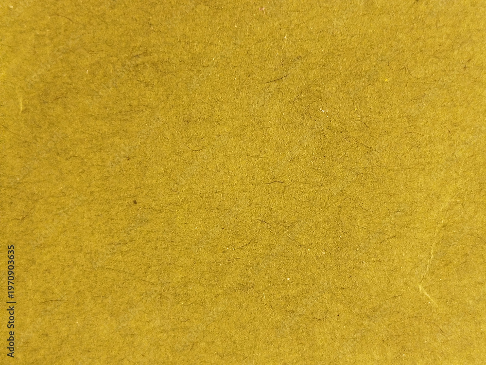 Fototapeta premium Textura de papel de color amarillo mostaza con fibras naturales