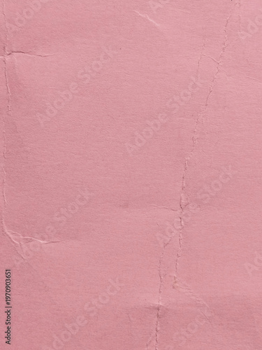 Textura de papel envejecido con pliegues y arrugas en color rosa viejo