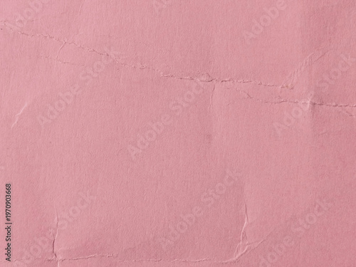 Textura de papel envejecido con pliegues y arrugas en color rosa viejo