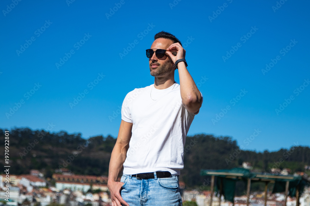 Fototapeta premium Casual man strolling on a sunny day
