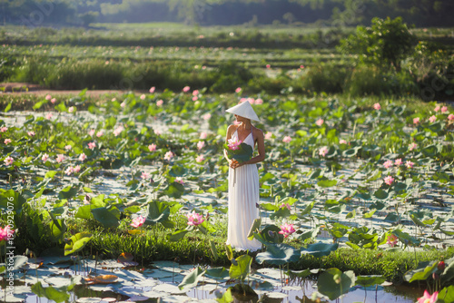 Woman Holding Lotus Flowers in Tra Ly Lotus Pond Vietnam