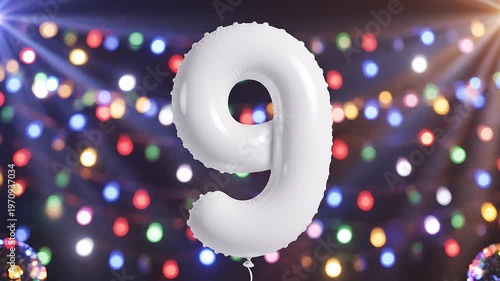 White number 9 balloon with colorful flashing disco lights. Festive video for birthday or anniversary party