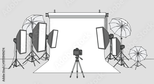 Professional photography studio equipment setup including a white backdrop, softboxes, umbrellas, and a camera on a tripod.