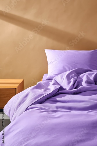 Bed with lavender sheets in minimal bedroom interior