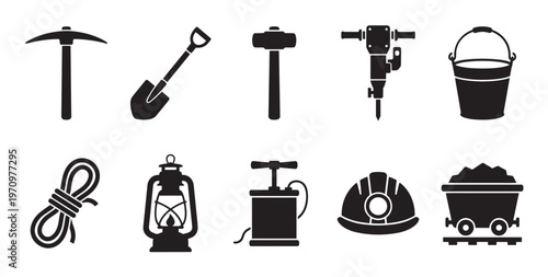 Collection of black silhouette icons representing various mining tools and equipment including a pickaxe shovel hammer jackhammer bucket rope lantern dynamite and cart.