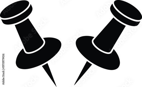 Two black push pins on a white background