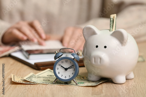 Woman with alarm clock, pig...