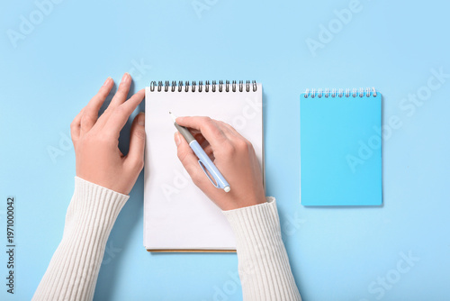 Female hands with notebooks...