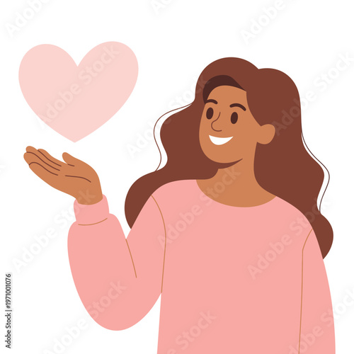 A smiling woman with long brown hair holding a heart