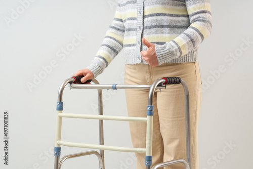 Mature woman with walker sh...