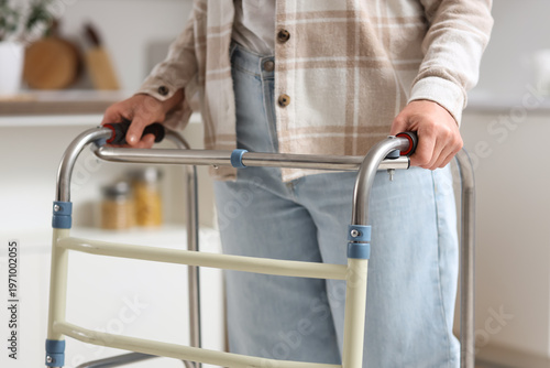Mature woman with walker in...