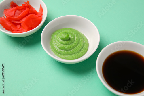 Bowls with wasabi, soy sauc...