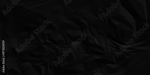 Black crumpled paper texture. Black wrinkled paper texture. Black crumpled and top view textures can be used for background of text or any contents.