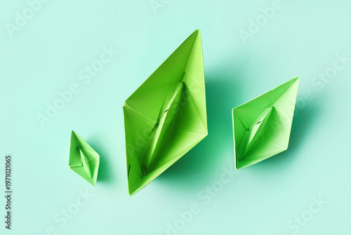 Green paper boats on turquo...