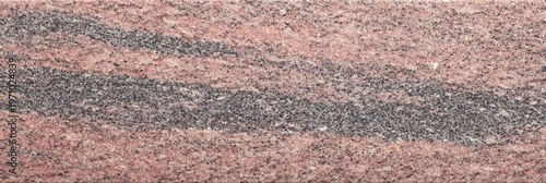 A detailed view of a leathered pink granite stone texture featuring wavy bands of dark grey and black minerals across a speckled reddish surface suitable for background use.