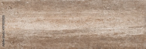A horizontal taupe rammed earth texture tile featuring a grainy surface with subtle horizontal banding and natural variations in brown and beige tones for a minimalist background.
