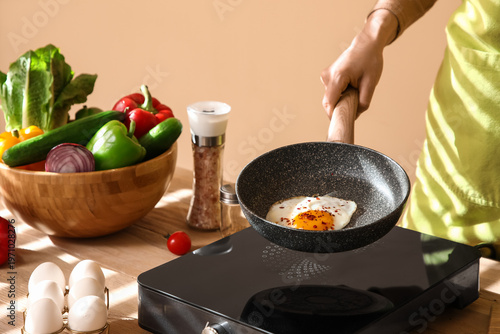 Woman with fresh vegetables...