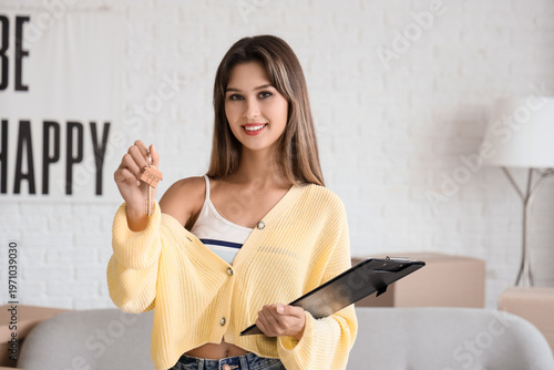 Young woman with house rent...