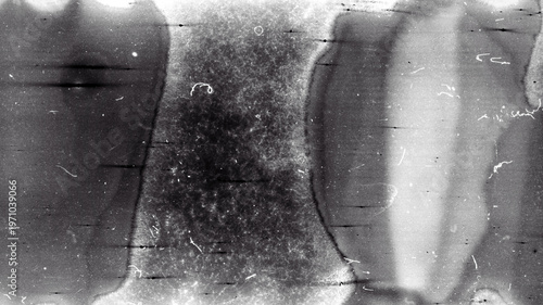 Blank grained film strip texture background with heavy grain, dust and light leak. Old expired moldy photographic film scan.
