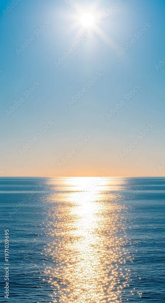 Fototapeta premium Bright sun reflecting on the ocean surface with clear blue sky, sunlight sparkling on water