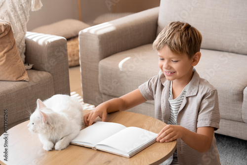 Cute little boy with cat re...