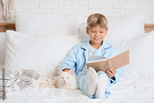 Cute little boy with cat re...