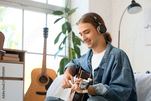 Young man with headphones p...