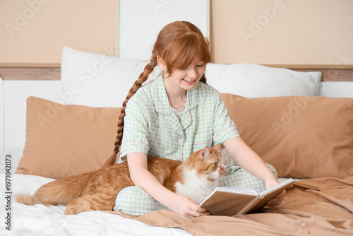 Teenage redhead girl in paj...
