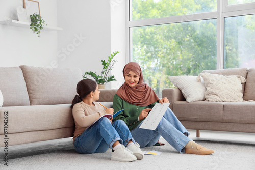 Muslim mother with her litt...