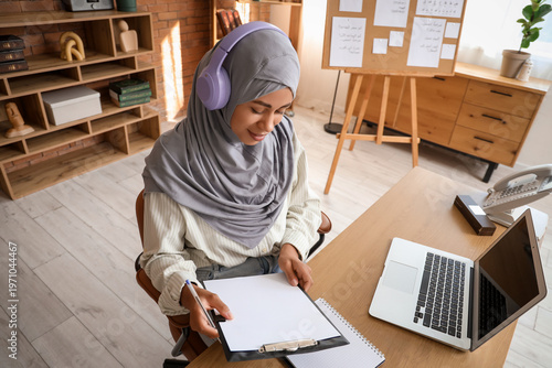 Young Muslim woman with hea...