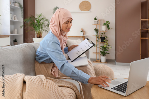 Young Muslim woman learning...