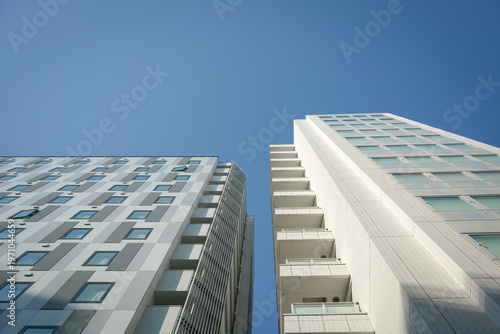 Modern commercial building architecture. Against blue sky. Low angle view.