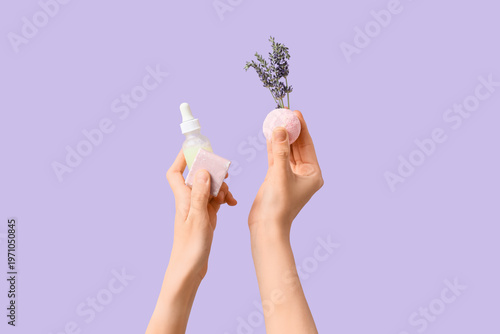 Female hands with bath bomb...