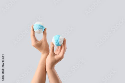 Female hands with bath bomb...