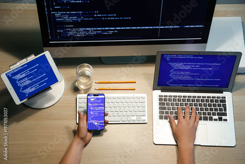 Male programmer working wit...