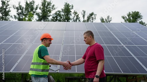 The engineer hands over the completed work on setting up solar panels to the customer. High quality 4k footage