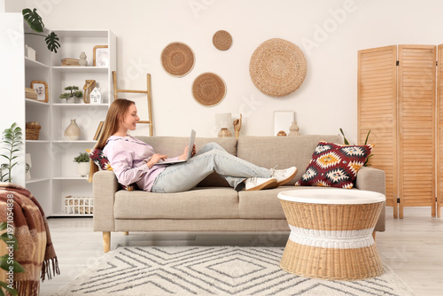 Beautiful young woman lying...
