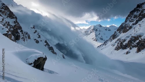 Dramatic avalanche in the snowy mountains under a cloudy sky, nature scene.