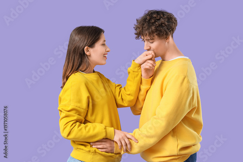 Young man kissing his girlf...