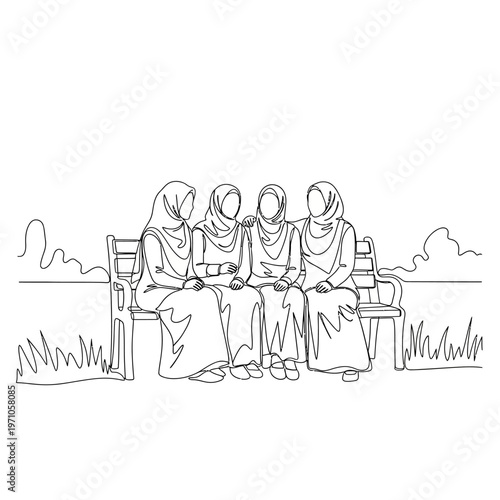 Four Women Wearing Headscarves Sitting Together.