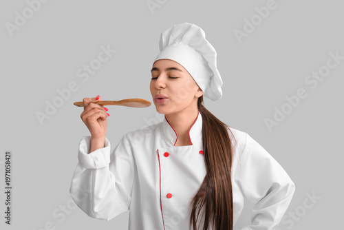 Young female chef with wood...