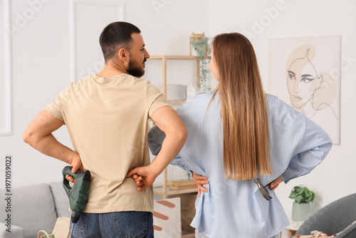 Young couple with tools aft...