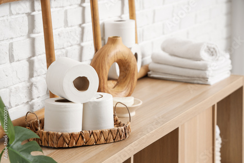Rolls of toilet paper on sh...