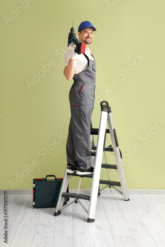Male technician with drill ...
