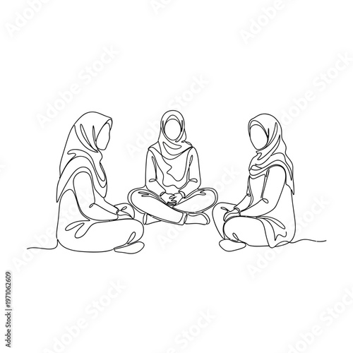 Three women wearing headscarves sitting.