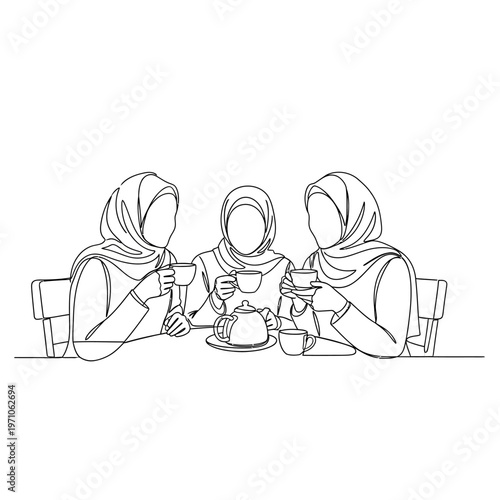 Three women wearing headscarves sitting together.