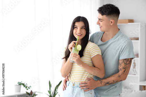 Happy young couple with gla...